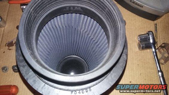 Air filter with blue pleated media, black rubber seal, and part number FD40D6 stamped on the housing