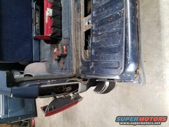 1987 Ford Bronco rear interior with tools and detached taillight