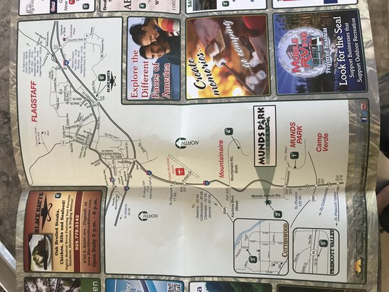 Folded map of Flagstaff and surrounding areas with advertisements