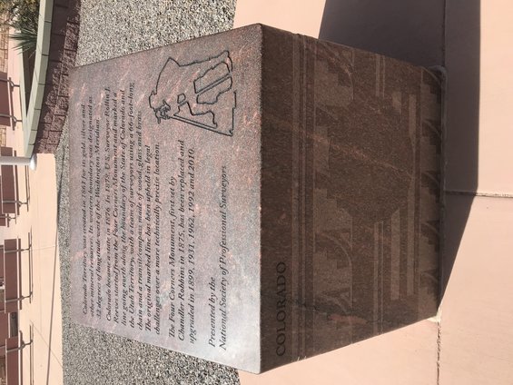 Granite monument at Four Corners, detailing its history and surveying