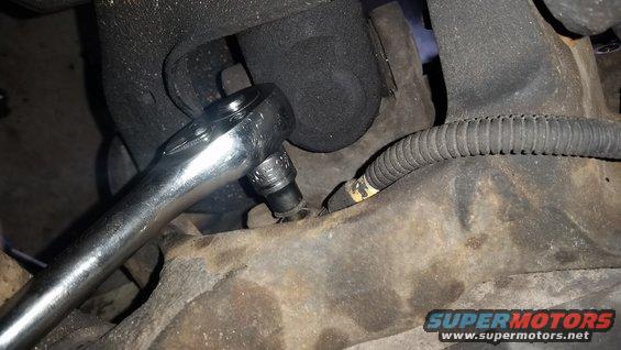 Don't forget this sucker.  It is a small bolt that threads into the spindle from behind.  Can't get the spindle off without this being gone, and you won't see it from the front.