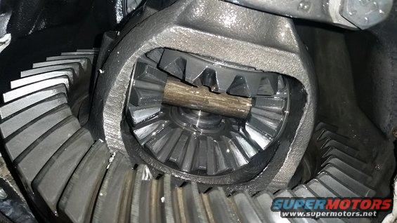 Now, once the last bolt is out we can swing the 3rd member away from the TTB and expose the guts.  Before we can finish removing it altogether, the E-clip must first be removed.  It can be pried out with a screwdriver fairly easily.  Once the E-clip is gone, the 3rd member can be gently removed from the remaining axle stub.