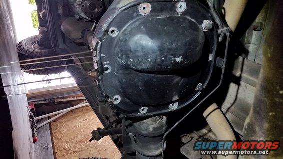 drain_the_diff.jpg Rear gears are much less work, although there is additional precision related to it.  Maybe its easier for me because I've done these so many times.

Start by draining the rear differential, leaving one or two bolts in the top of the cover so that oil doesn't get splashed all over the place.  I'd rather have a controlled mess than just a mess.