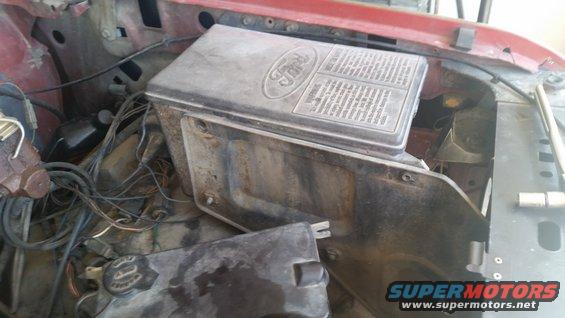 Ford fuse box with wiring and instructions visible