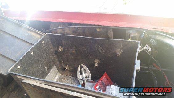 Underhood toolbox with pliers and red packaging inside