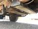 1984 Ford Bronco - Underside view of a vehicle, showing skid plates and suspension components.