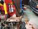 1995 Ford F-150 - With a prybar on the other end keeping the lever tight to the box, smack the nut's face to drive the shaft's splines out of the lever.
