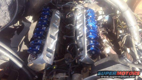 kimg0186.jpg new cylinder heads on. 

unfortunately my original Explorer valve covers did not clear the rockers. a set of stock truck covers did clear with the baffles removed but i chose to order some new stamped Edelbrock valve covers