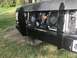 1989 Ford Bronco - This black SUV's front end shows extensive aftermarket modifications, including winch guards and dual electric fans.