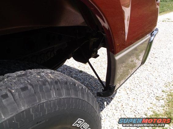 Red 2008 Ford F-150 rear wheel and two-tone lower body panel