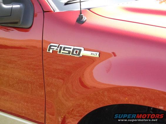 Red 2008 Ford F-150 XLT fender badge