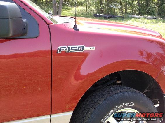 Red 2008 Ford F-150 XLT fender and tire