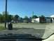 1979 Ford Bronco - Street view of various businesses under a clear blue sky.