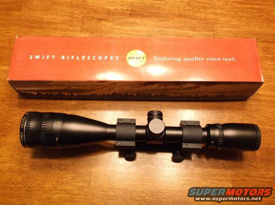Swift rifle scope with box, text reads "SWIFT RIFLESCOPES Enduring quality since 1926."