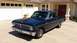 2008 Ford Focus - This dark blue 1964 Ford Falcon pickup truck is parked in front of a suburban home.