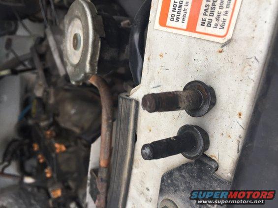 Engine bay bolts and warning labels