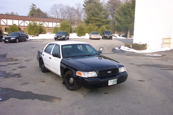 Black and white police car, 3/4 front view. License plate 177-8339