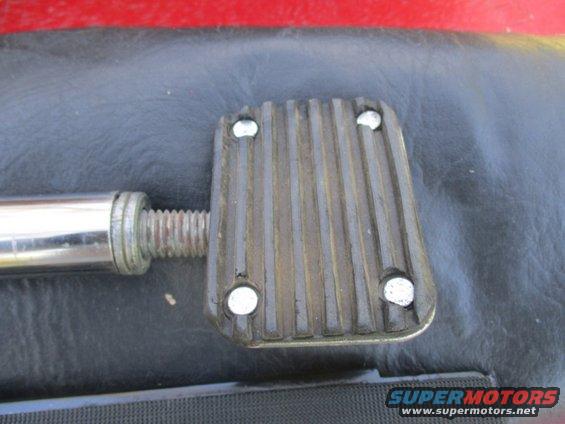 Close-up of a ribbed pedal with a threaded metal shaft