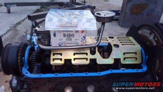 kimg0203.jpg i decided because i am building this truck for higher rpm range, i wanted to increase oil pressure. so i bought a high volume oil pump and then installed a high pressure oil pump spring. it wil lnot be a high volume high pressure oil pump

i also installed a louvered windage tray with ARP main cap studs to help