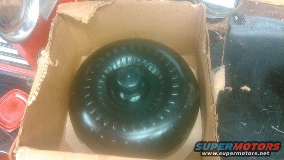 Black torque converter in cardboard box