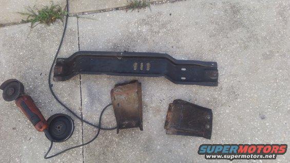 kimg0214.jpg this is the stock crossemember of the F250. it was originally for a 4x4 AOD and all i did was move it back an inch or so for the 4R70W swap. despite the transmissions being very similar and using the same transfer case as the original, the front driveshaft interfered quite alot of it. 

i experimented with a few ways to take care of this but nothing would give enough clearance for without causing other issues. i decided i would go ahread and cut and weld the crossmeember with a dropped section to have clearance. i may change the crossemember in the future but i needed something to hold the transmission for now