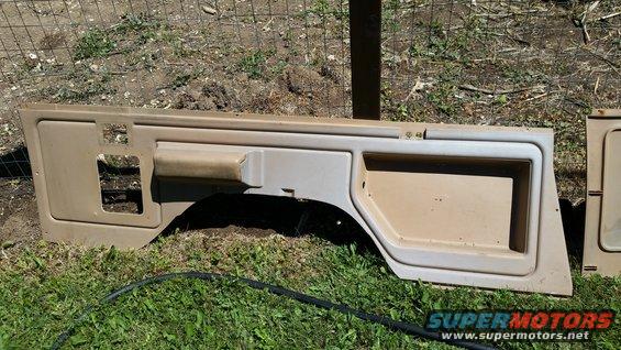 Tan interior door panels laid on grass
