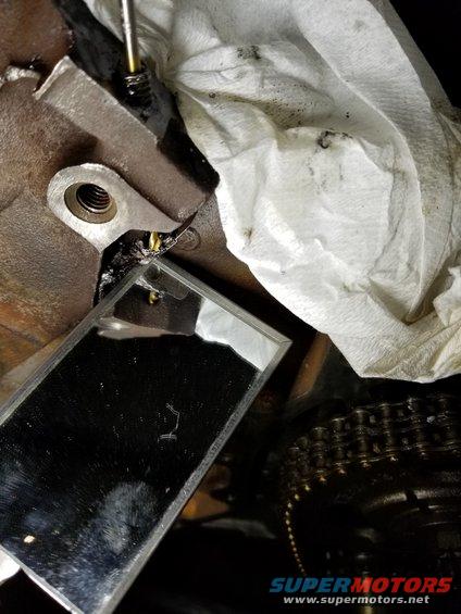 I drilled through, to check that the hole was centered & aligned, and stepped up 1/32" at a time to 1/4", which I drilled left-handed.

See the PREVious & NEXT few pics...