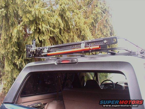 Hi Lift Jack Mounted to Surco Rack, using home made mounting system similair to Hi lifts 4xRack, With Padlocks
