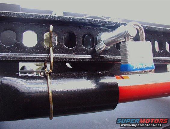 Drilled through a 1/2" Carraige bolt, twice for the padlocks, just a deterent the same as Hi lift uses for there racks. Drilling through Bolts is no easy task without a drill press