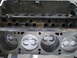 1969 Ford Mustang - Engine block with pistons installed. Text is visible on the pistons, but the vehicle year is not identifiable.