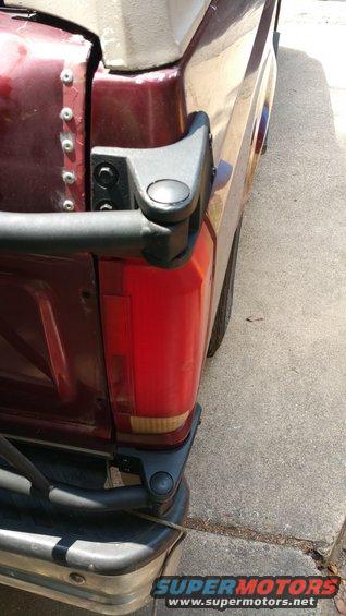 1996 Ford Bronco rear corner showing taillight and spare tire carrier mount