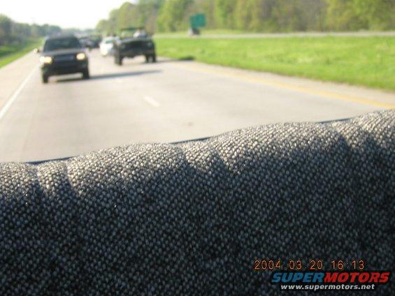 View from inside a car looking out at other vehicles on a highway