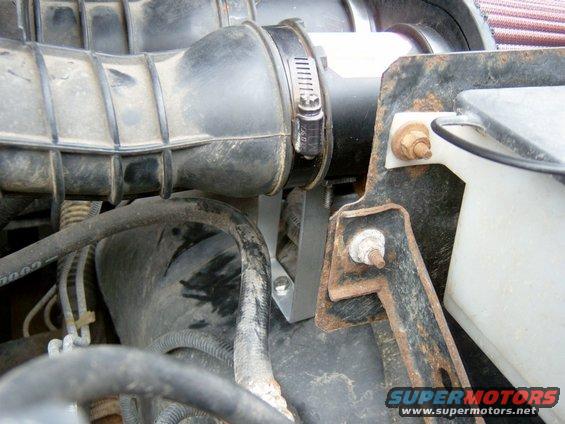 It just bolts to the inner-fender.