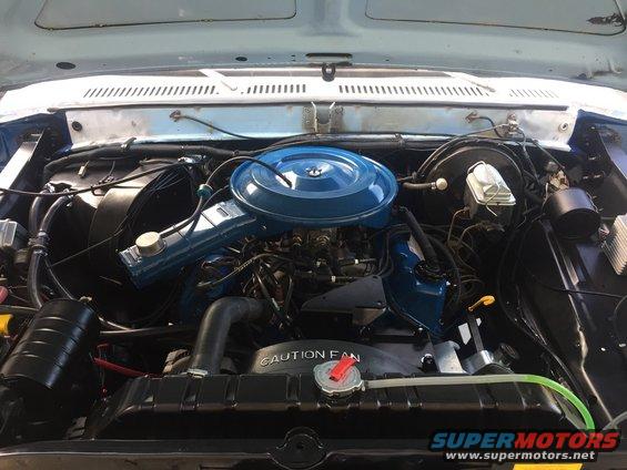 1978 Ford Bronco engine bay with blue air cleaner and blue valve covers