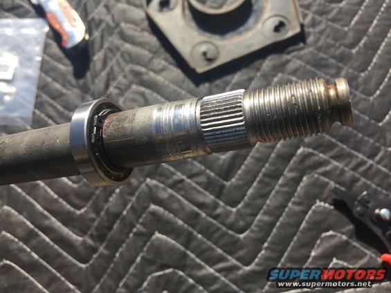 Close-up of a splined shaft with a bearing on it, likely part of a steering or drivetrain component