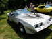 1971 Ford Ranchero - A silver 1977 Pontiac Firebird Trans Am is displayed outdoors with a yellow car nearby.