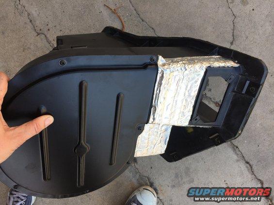 black plastic HVAC ducting with silver insulation tape