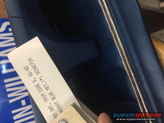 Close-up of a blue interior trim sample card with text indicating 'NIGHT BLUE MET. ( * ) SEIW#2718' and '81-82'