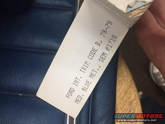 Blue interior upholstery with a 1978-79 Ford trim code label