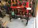 1992 Jeep Wrangler - Workshop scene a hydraulic press and sandblaster with various tools and equipment.