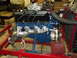 1969 Ford Mustang - A V8 engine, possibly a Ford Cobra, is mounted on a stand with a carburetor and exhaust manifolds visible.
