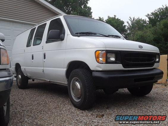 White 1999 Ford E250 cargo van, 3/4 front view