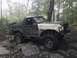 1989 Ford Bronco - This 1989 Ford Bronco navigates a challenging off-road course with large tires and a lifted suspension.