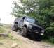 1989 Ford Bronco - Modified 1989 Ford Bronco tackling a challenging off-road trail.