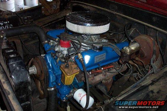 Ford V8 engine with blue valve covers, chrome air cleaner, and oil filter