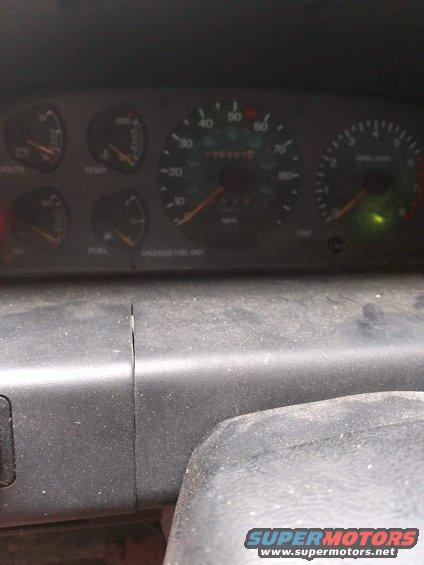 Dashboard with a digital display and a green indicator light