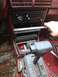 1989 Ford Probe - Measuring the center console area of a car interior, with visible rust on the floor.