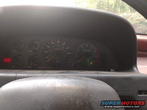 Interior dashboard gauges with odometer reading 68636.75