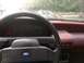 1989 Ford Probe - Interior view of a 1989 Ford Probe, with a second vehicle visible outside.
