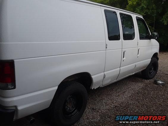 White 1999 Ford E250 cargo van, side view